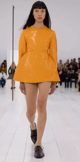 Loewe SS25 look featuring vibrant orange