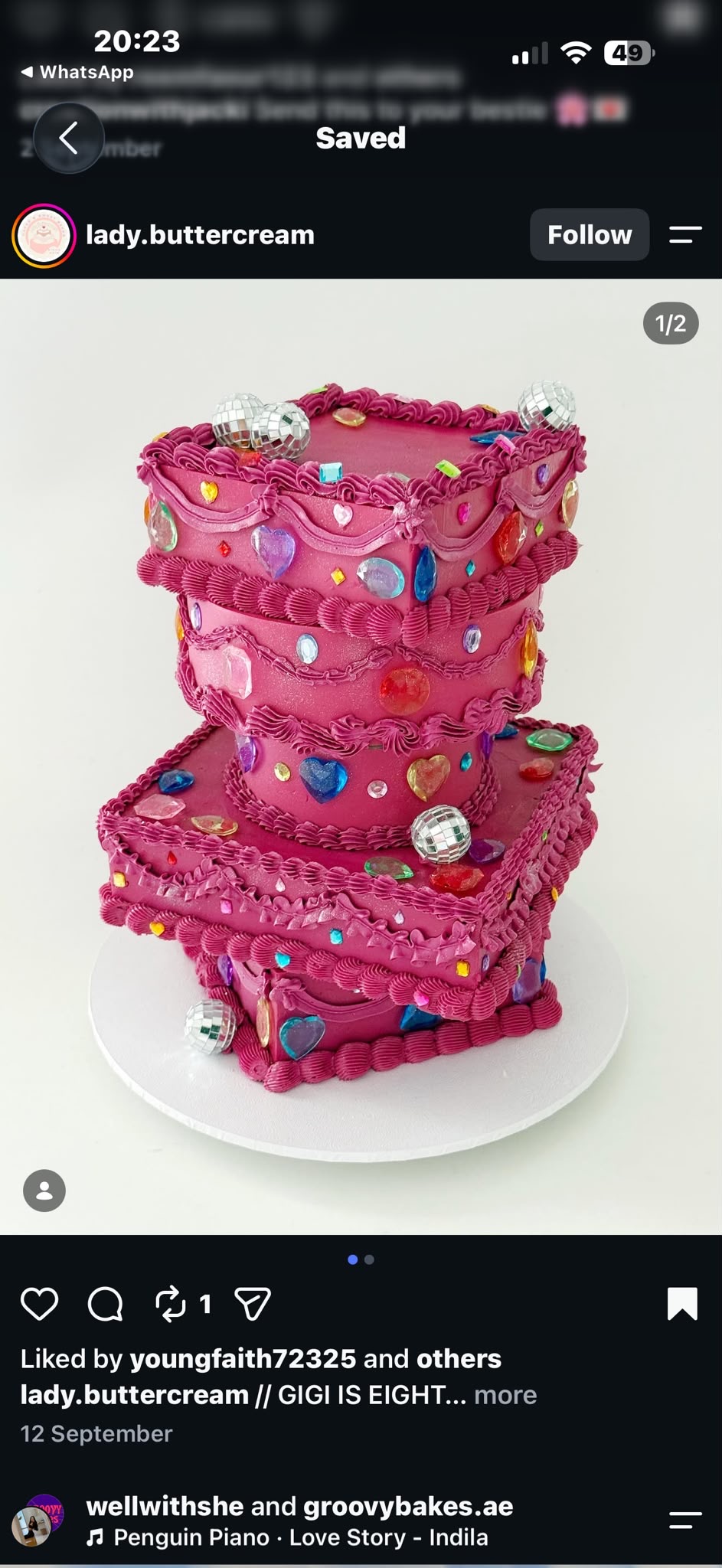 Tiered pink cake decorated with colourful jewel embellishments