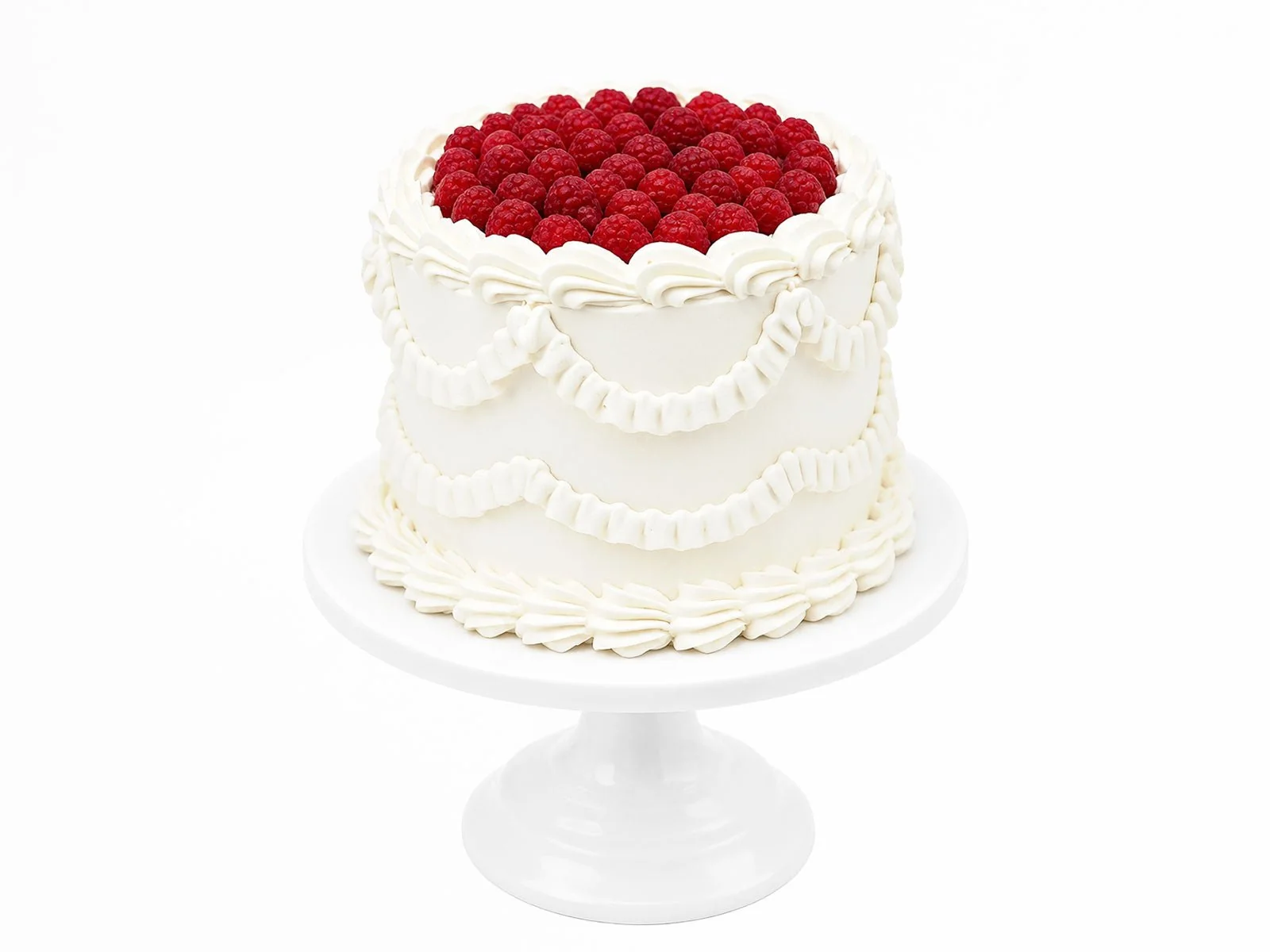 Vintage-style cake topped with fresh raspberries and decorative piping