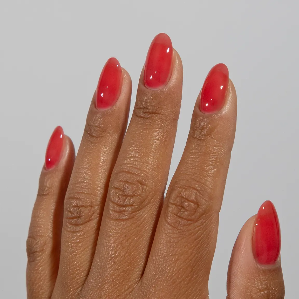 Wildberry pink-red jammy nails with a glossy translucent jelly finish