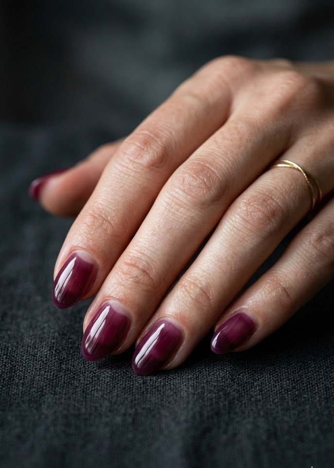 Deep berry jelly nails with a glossy dark autumn finish