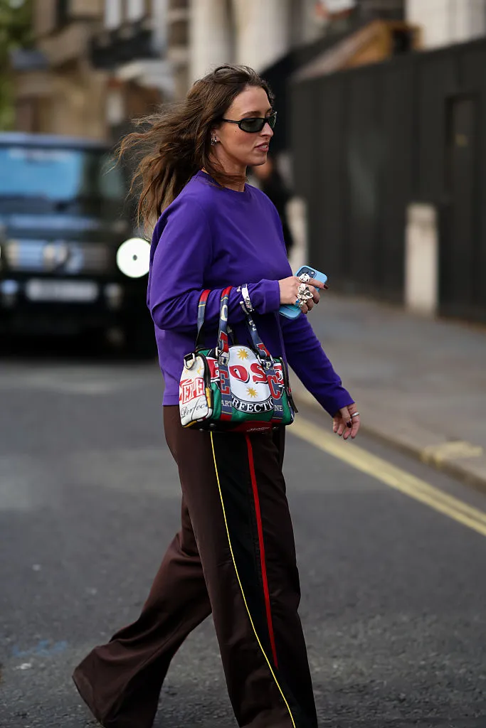 Royal purple top worn with dark brown trousers during the 2026 fashion season