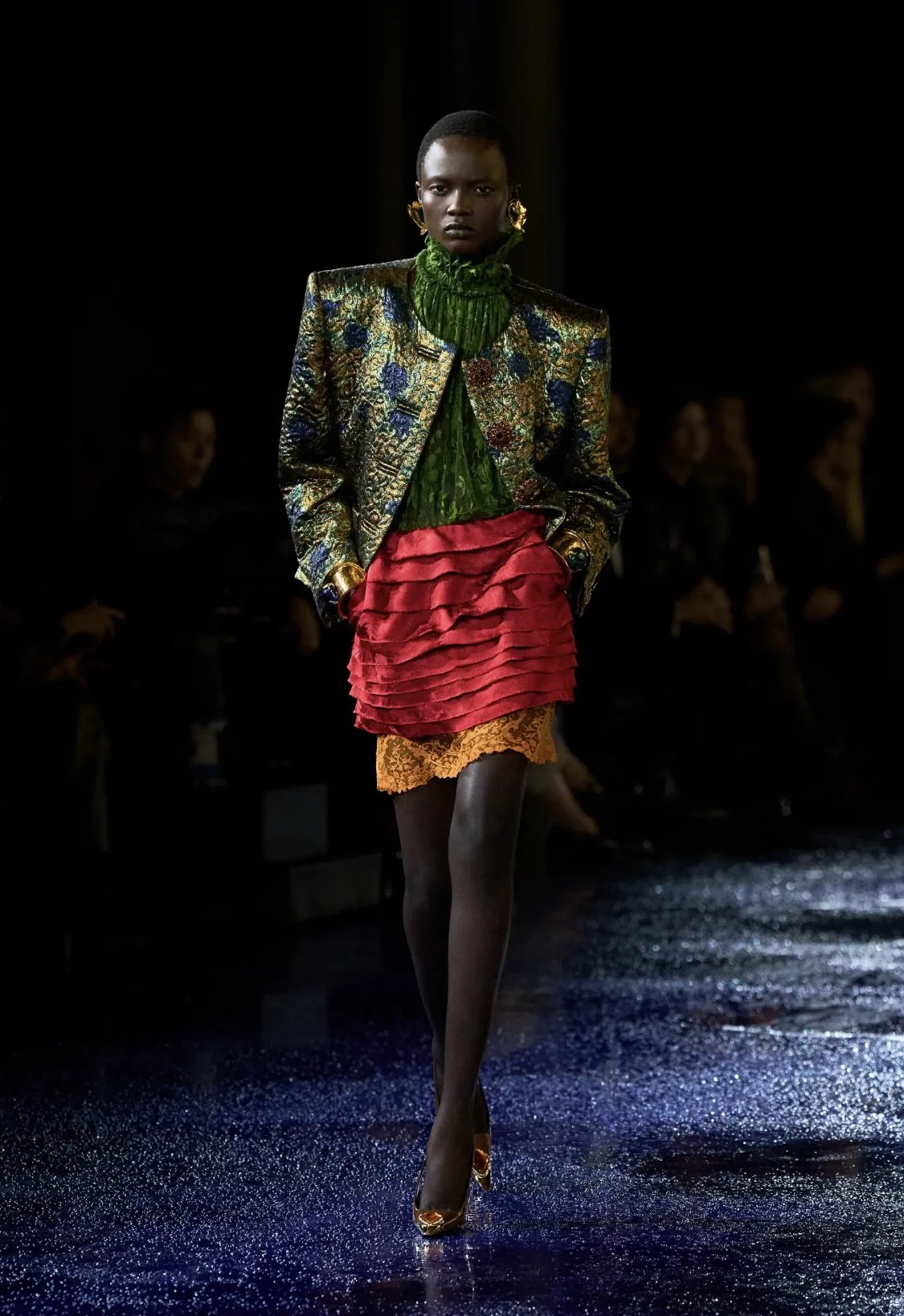 Models showcasing Spring 2025 fashion trends on the runway.
