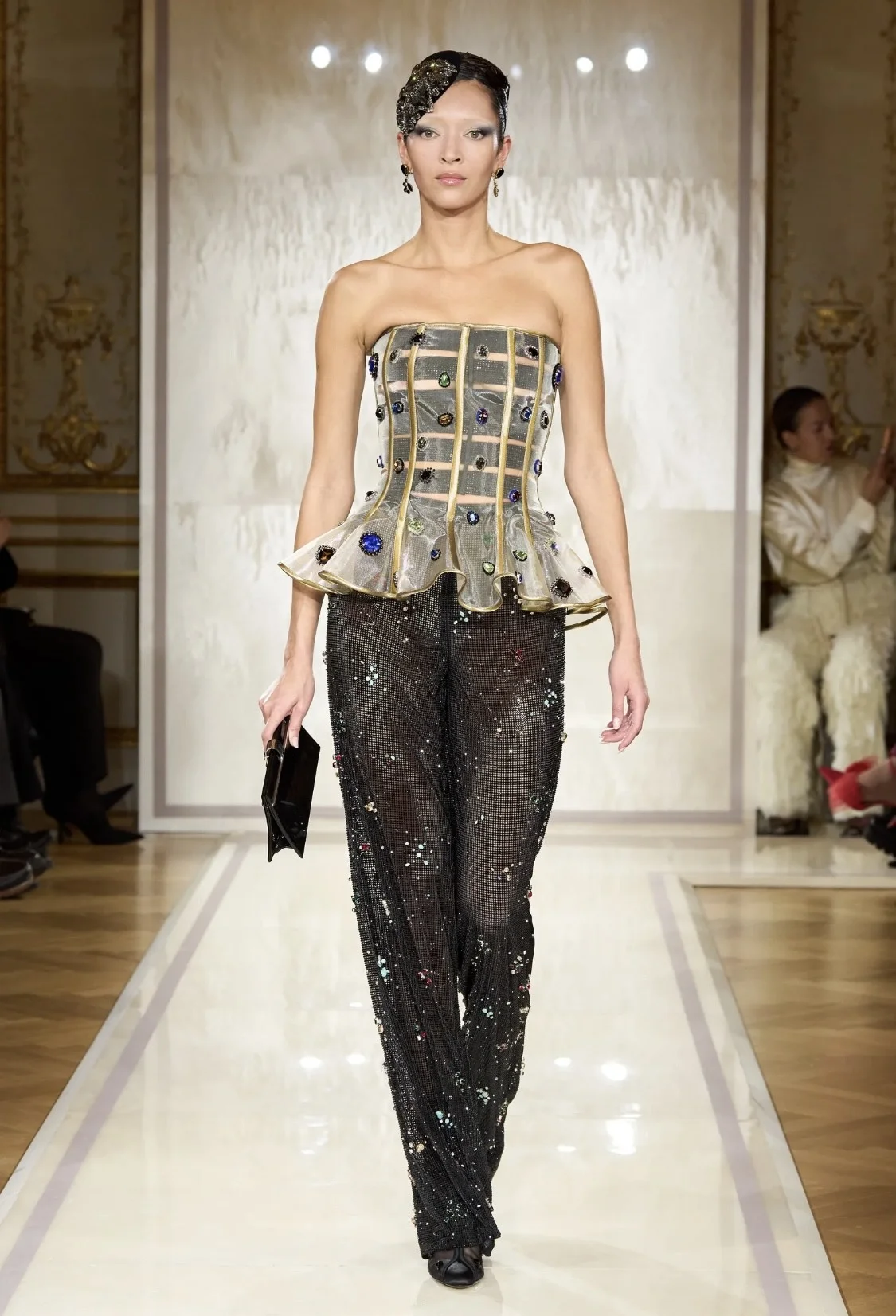 Models showcasing Spring 2025 fashion trends on the runway.