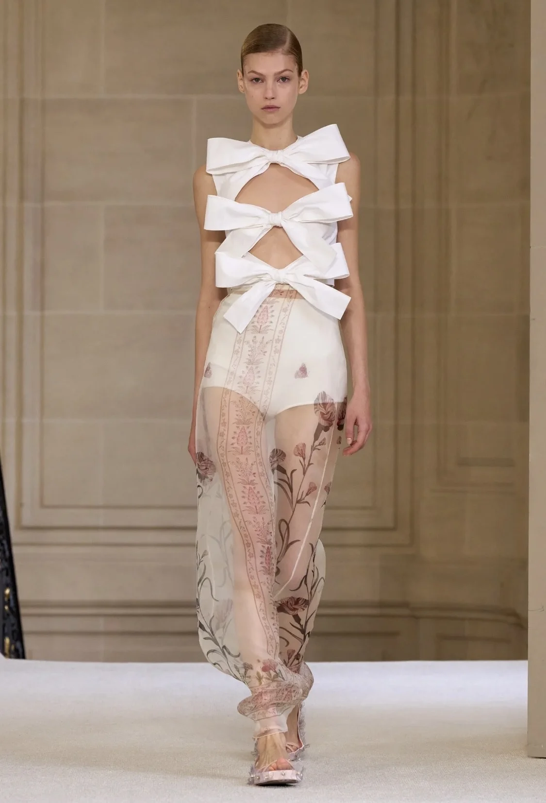 Models showcasing Spring 2025 fashion trends on the runway.