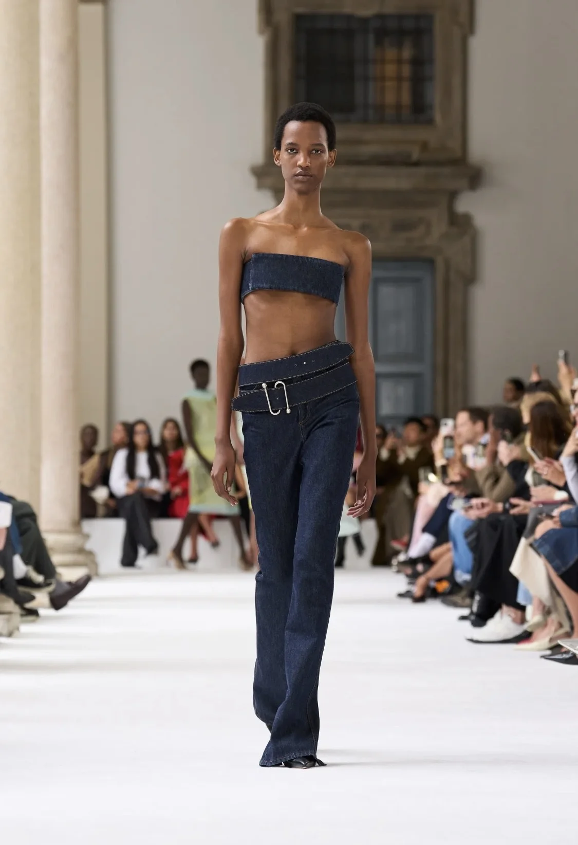 Models showcasing Spring 2025 fashion trends on the runway.