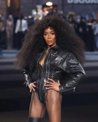 Naomi Campbell with ultra-long, waist-grazing glossy hair at the runway show