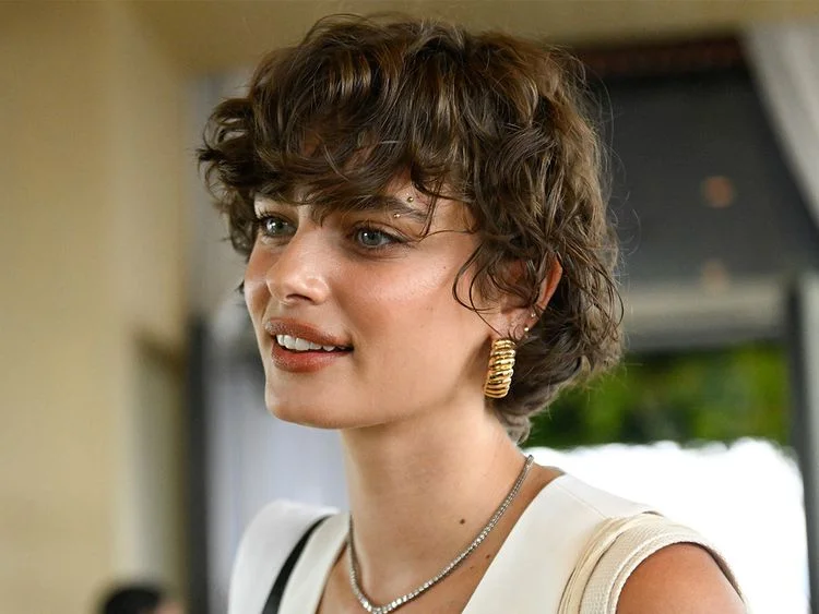 Modern pageboy bob haircut with voluminous layers and fringe