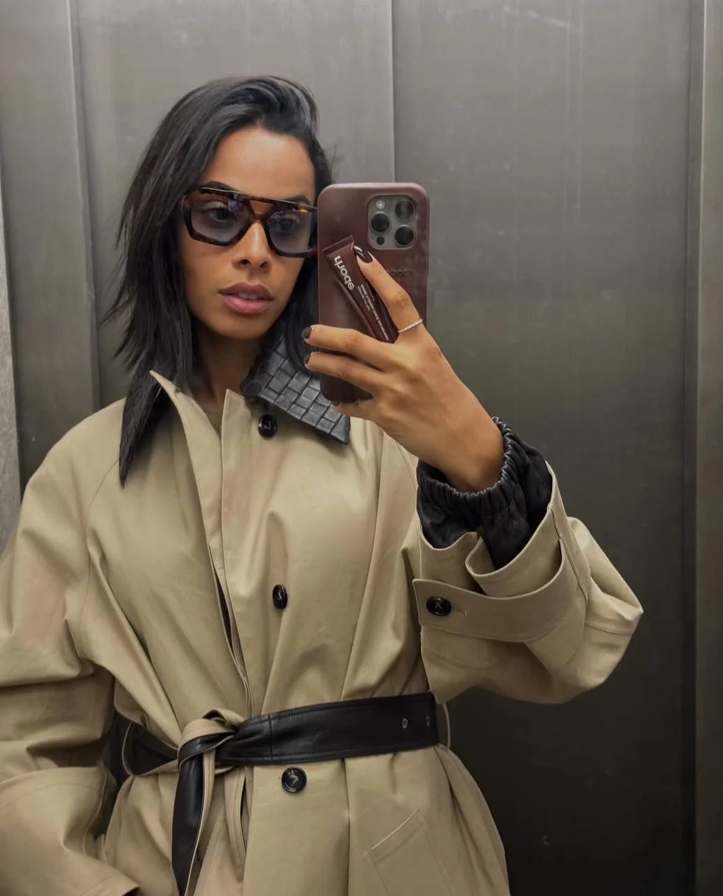Long bob (lob) haircut with deep side part on black hair